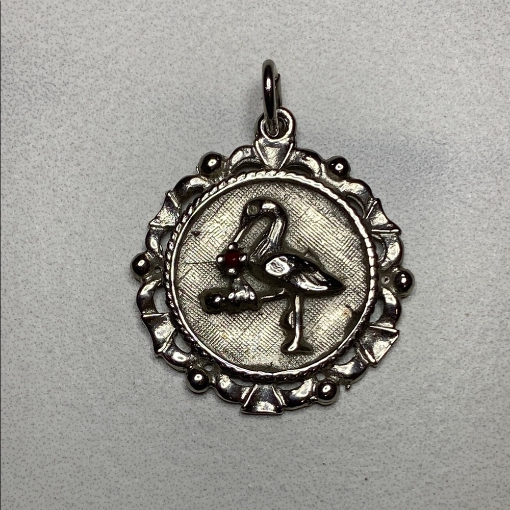 Sterling Silver Storkโ Pendant with red gem